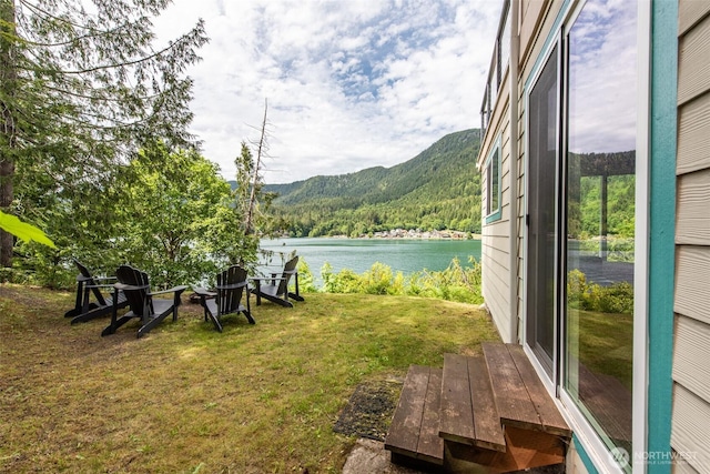 49 Sunny Point Ln, Port Angeles, WA 98363 - view of grassy yard featuring a water and mountain view and a view of trees