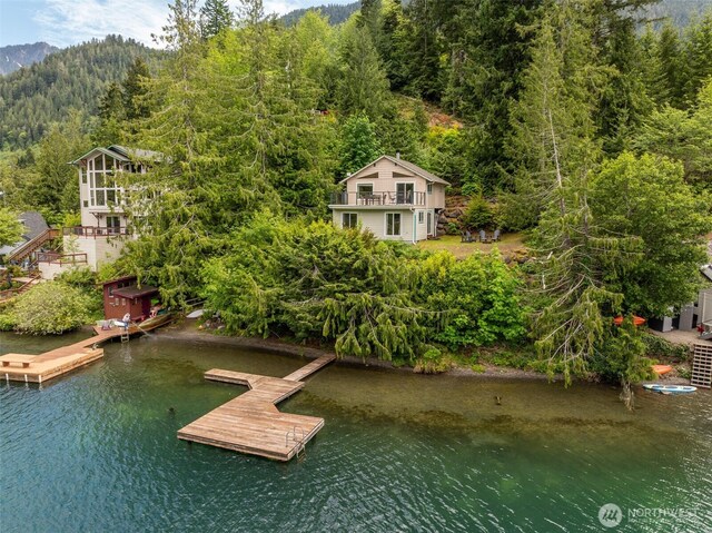 49 Sunny Point Ln, Port Angeles, WA 98363 - view of subject property with a heavily wooded area and a large body of water