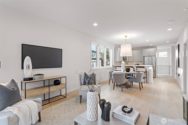 8017 126th Ave NE Unit B, Kirkland, WA 98033 - living room with light wood-type flooring, recessed lighting, and baseboards