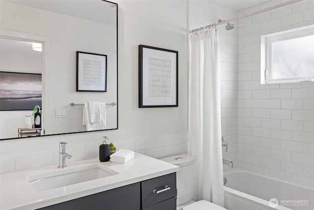8017 126th Ave NE Unit B, Kirkland, WA 98033 - bathroom featuring vanity, toilet, shower / bath combo with shower curtain, and tile walls