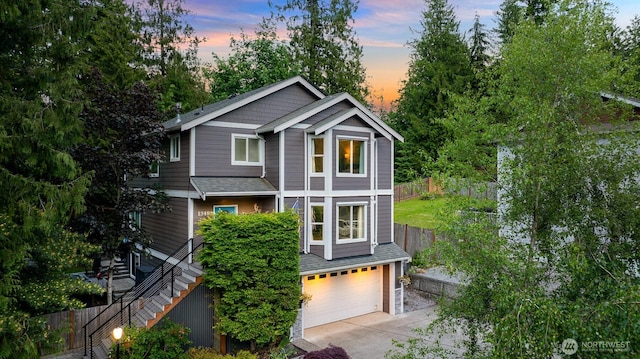 1348 Parkstone Ln, Bellingham, WA 98229 - view of front of house featuring an attached garage, driveway, stairs, and a shingled roof