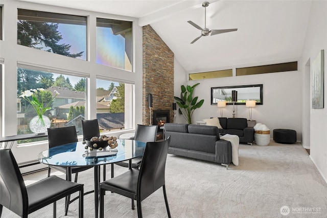 423 99th Ave NE Unit 6, Bellevue, WA 98004 - dining room featuring high vaulted ceiling, a fireplace, ceiling fan, beamed ceiling, and carpet floors