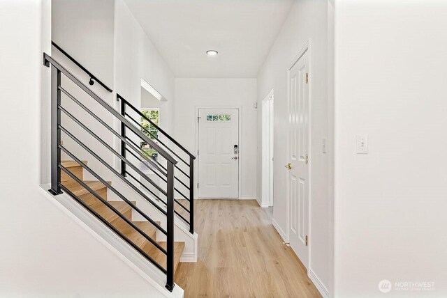 24212 112th Ave SE, Kent, WA 98030 - entryway with light wood finished floors, stairs, and baseboards
