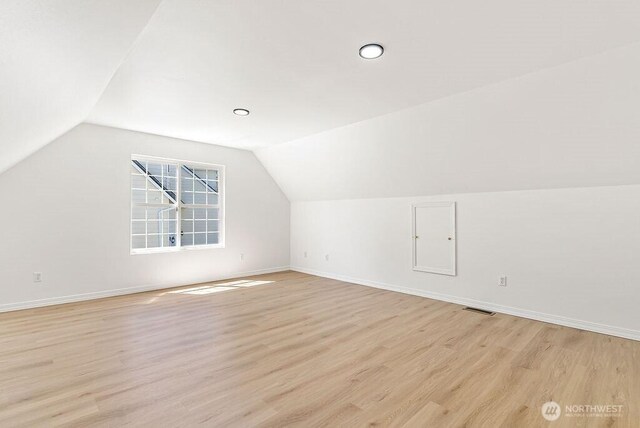 24212 112th Ave SE, Kent, WA 98030 - additional living space featuring lofted ceiling, light wood-style floors, and baseboards