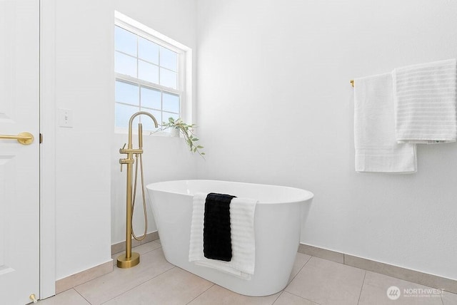 24212 112th Ave SE, Kent, WA 98030 - full bathroom with baseboards, a freestanding bath, and tile patterned floors