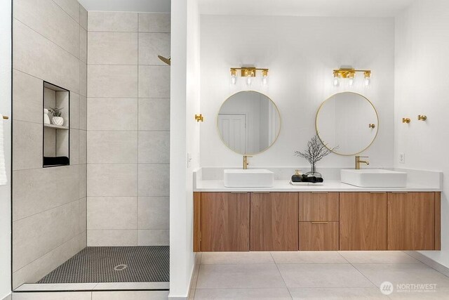 24212 112th Ave SE, Kent, WA 98030 - full bathroom featuring double vanity, tile patterned floors, and a tile shower