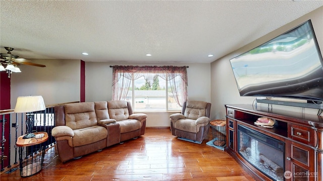 1306 Makah St NE, Olympia, WA 98516 - living area with wood finished floors, recessed lighting, a textured ceiling, and ceiling fan
