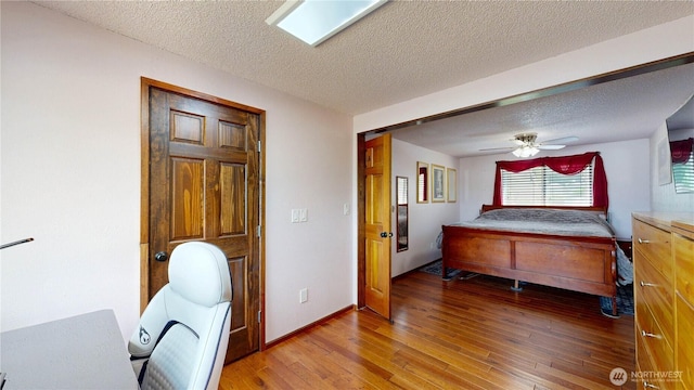 1306 Makah St NE, Olympia, WA 98516 - office with a textured ceiling, wood finished floors, and a ceiling fan