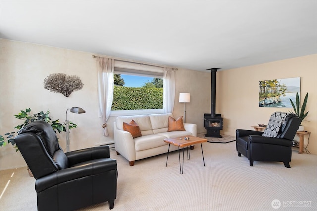 2514 Haines St, Port Townsend, WA 98368 - living room with a baseboard heating unit, light colored carpet, and a wood stove