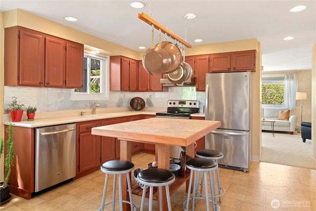 2514 Haines St, Port Townsend, WA 98368 - kitchen with appliances with stainless steel finishes, light countertops, light flooring, healthy amount of natural light, and recessed lighting
