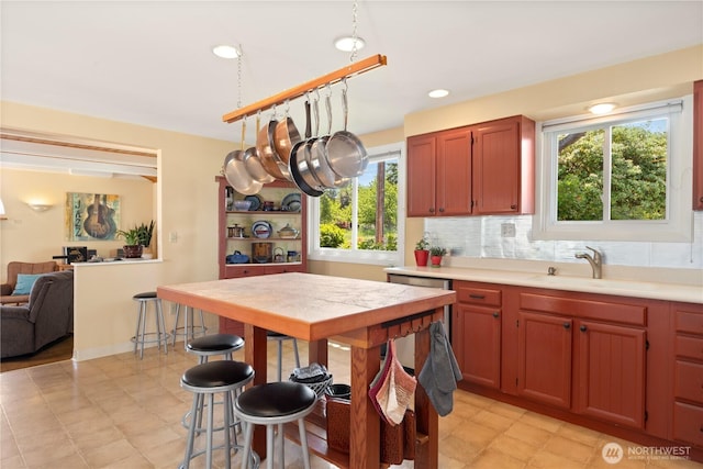 2514 Haines St, Port Townsend, WA 98368 - kitchen featuring a sink, light countertops, backsplash, recessed lighting, and open floor plan