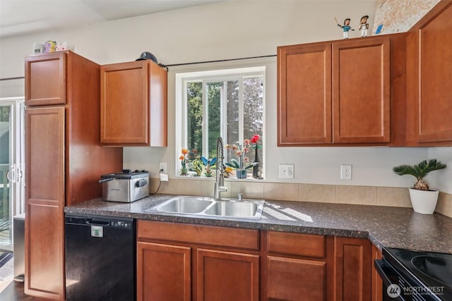 38431 147th St SE, Gold Bar, WA 98251 - kitchen featuring black appliances, dark countertops, and brown cabinetry