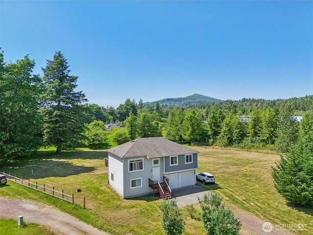 38431 147th St SE, Gold Bar, WA 98251 - view of front of home with driveway, a wooded view, and a garage