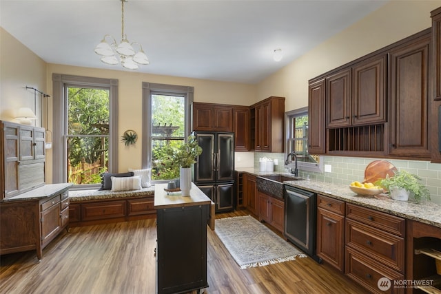 925 Wilson St, Port Townsend, WA 98368 - kitchen featuring fridge, dishwasher, a sink, a chandelier, and decorative backsplash