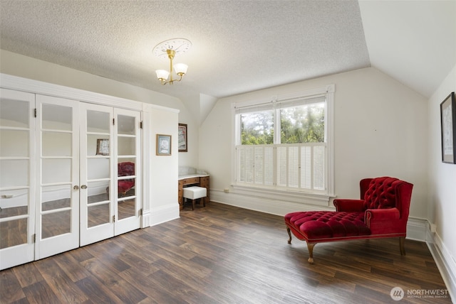 925 Wilson St, Port Townsend, WA 98368 - living area with vaulted ceiling, wood finished floors, a chandelier, and baseboards