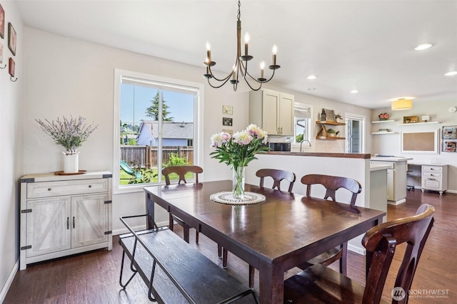 6413 152nd Ave E, Sumner, WA 98390 - dining space with dark wood-type flooring, a chandelier, recessed lighting, and baseboards