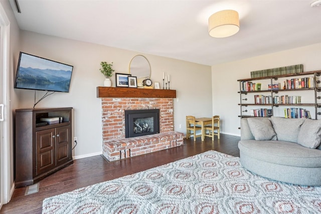6413 152nd Ave E, Sumner, WA 98390 - living area with wood finished floors, a fireplace, and baseboards
