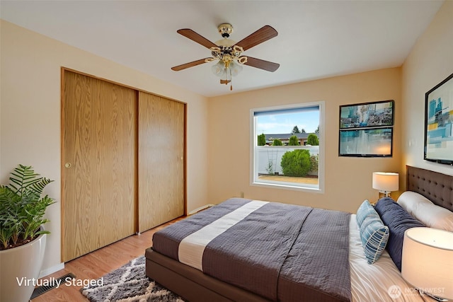 716 Dennis St SE Unit 93, Tumwater, WA 98501 - bedroom with light wood finished floors, a closet, and a ceiling fan