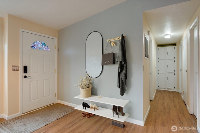 716 Dennis St SE Unit 93, Tumwater, WA 98501 - foyer with wood finished floors and baseboards