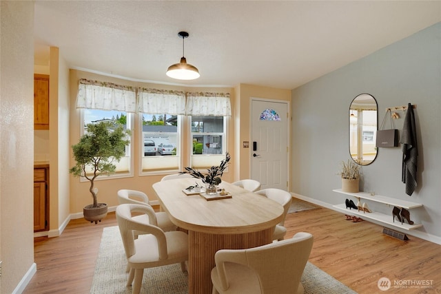716 Dennis St SE Unit 93, Tumwater, WA 98501 - dining area featuring light wood finished floors and baseboards