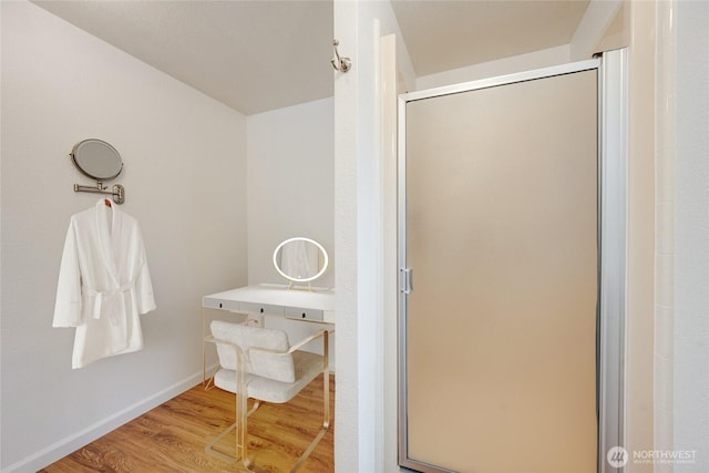 716 Dennis St SE Unit 93, Tumwater, WA 98501 - full bathroom featuring wood finished floors and a shower stall