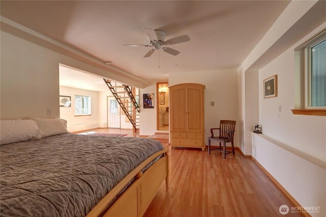 905 Bywater Way, Port Ludlow, WA 98365 - bedroom featuring light wood-type flooring and baseboards