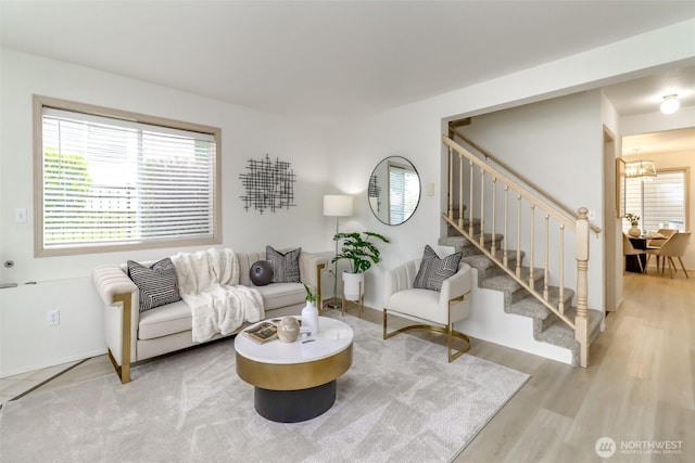 5129 Green Hills Ave NE Unit A, Tacoma, WA 98422 - living room featuring stairs, plenty of natural light, light wood-type flooring, and a chandelier