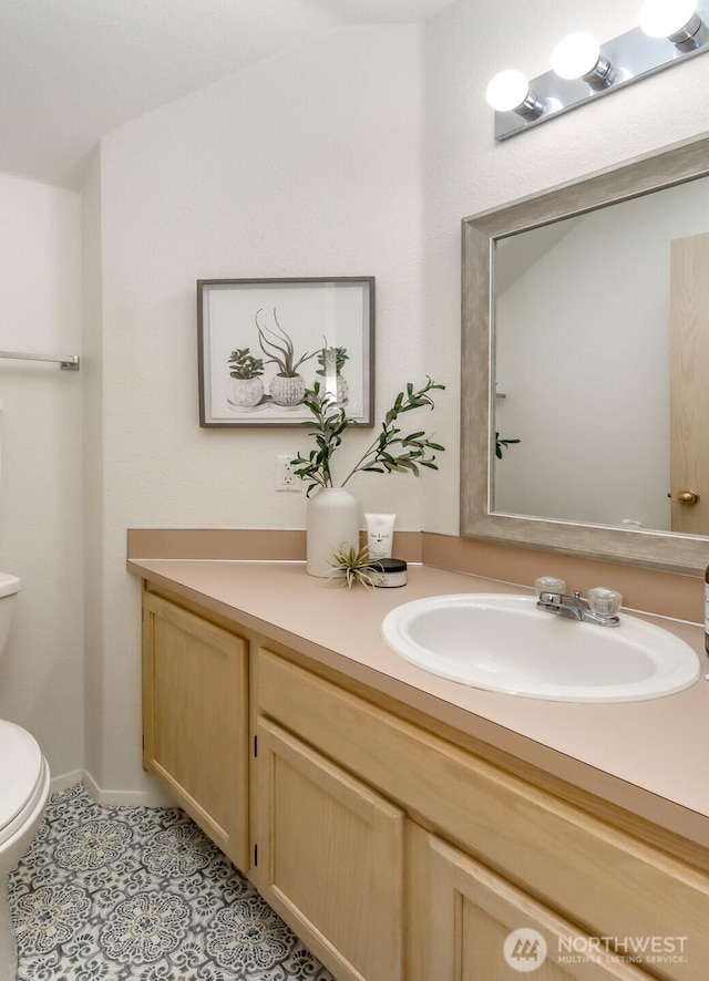 5129 Green Hills Ave NE Unit A, Tacoma, WA 98422 - bathroom featuring toilet, vanity, and tile patterned flooring