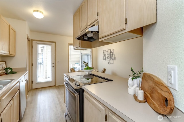 5129 Green Hills Ave NE Unit A, Tacoma, WA 98422 - kitchen featuring stainless steel range with electric stovetop, light brown cabinetry, light wood-style floors, and light countertops
