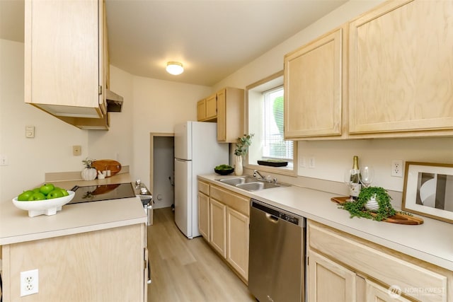 5129 Green Hills Ave NE Unit A, Tacoma, WA 98422 - kitchen featuring stainless steel dishwasher, a sink, light brown cabinets, freestanding refrigerator, and light wood-style flooring