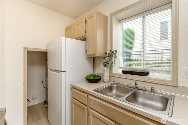 5129 Green Hills Ave NE Unit A, Tacoma, WA 98422 - kitchen featuring light brown cabinetry, freestanding refrigerator, plenty of natural light, and light countertops