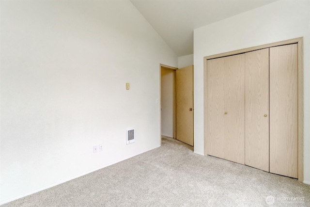 5129 Green Hills Ave NE Unit A, Tacoma, WA 98422 - unfurnished bedroom featuring carpet flooring, vaulted ceiling, and a closet