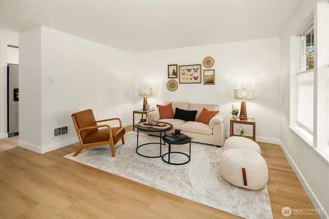 2515 Summit Ave, Everett, WA 98201 - living room featuring wood finished floors, plenty of natural light, and baseboards