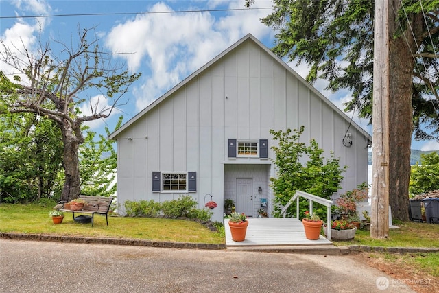 17257 Olympic View Rd NW, Silverdale, WA 98383 - view of front of home with board and batten siding and a front yard