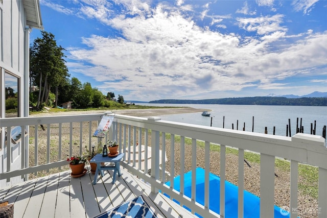 17257 Olympic View Rd NW, Silverdale, WA 98383 - wooden deck featuring a water and mountain view and a boat dock