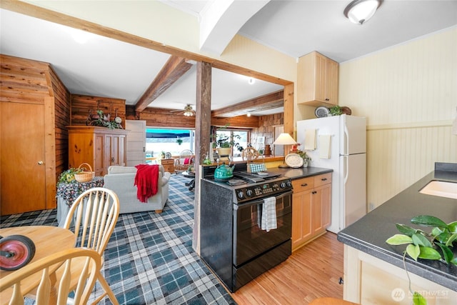 17257 Olympic View Rd NW, Silverdale, WA 98383 - kitchen with electric range, dark countertops, ceiling fan, light wood-style flooring, and freestanding refrigerator