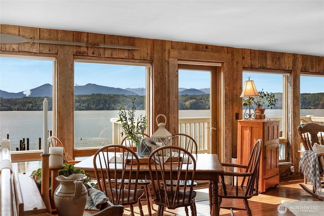 17257 Olympic View Rd NW, Silverdale, WA 98383 - dining area with wood finished floors, wooden walls, and a water and mountain view