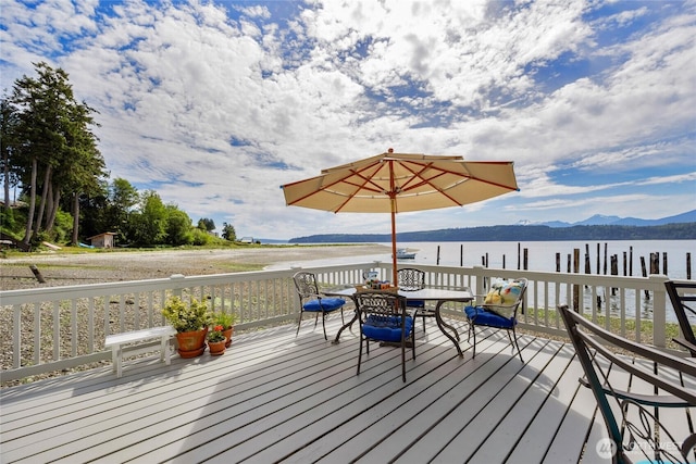 17257 Olympic View Rd NW, Silverdale, WA 98383 - wooden terrace featuring a water and mountain view and outdoor dining space