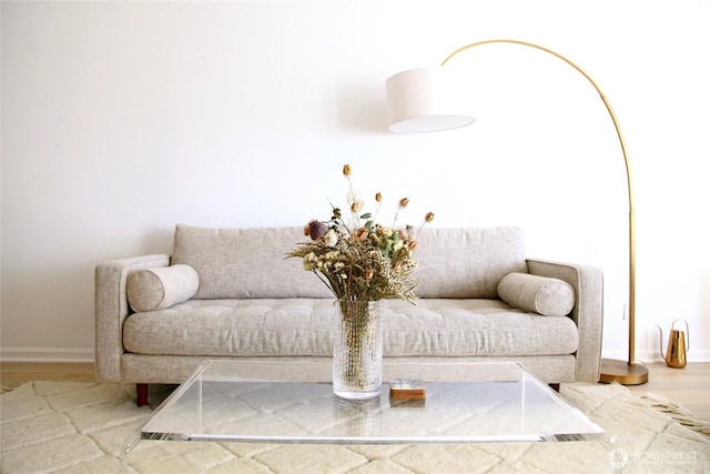1900 Alaskan Way Unit 105, Seattle, WA 98101 - sitting room with wood finished floors and baseboards