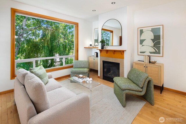 1414 25th Ave Unit B, Seattle, WA 98122 - living room featuring wood finished floors, a fireplace, and recessed lighting