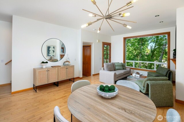 1414 25th Ave Unit B, Seattle, WA 98122 - dining room featuring light wood-style floors and a chandelier