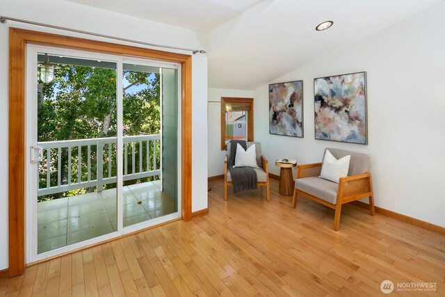 1414 25th Ave Unit B, Seattle, WA 98122 - living area featuring vaulted ceiling and light wood finished floors