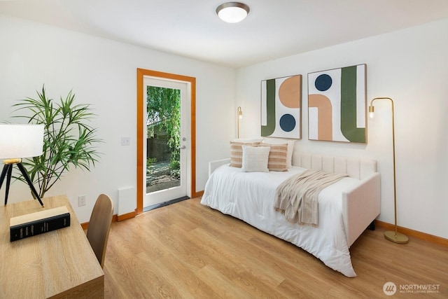 1414 25th Ave Unit B, Seattle, WA 98122 - bedroom featuring access to outside and light wood-style floors