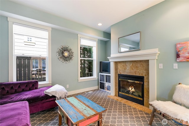 805 11th St, Bellingham, WA 98225 - living area featuring a tiled fireplace, carpet, and baseboards