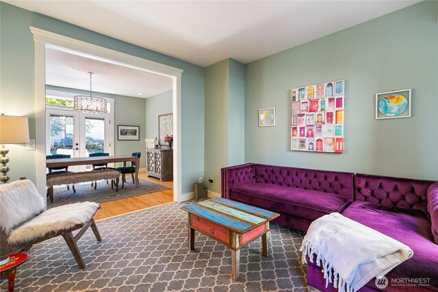 805 11th St, Bellingham, WA 98225 - living room with a chandelier, wood finished floors, baseboards, and french doors