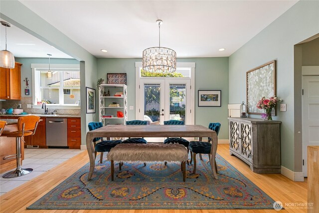 805 11th St, Bellingham, WA 98225 - dining area with light wood-style floors, french doors, a chandelier, and recessed lighting