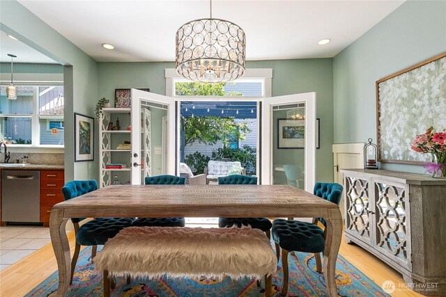 805 11th St, Bellingham, WA 98225 - dining space with light wood-style flooring and a chandelier