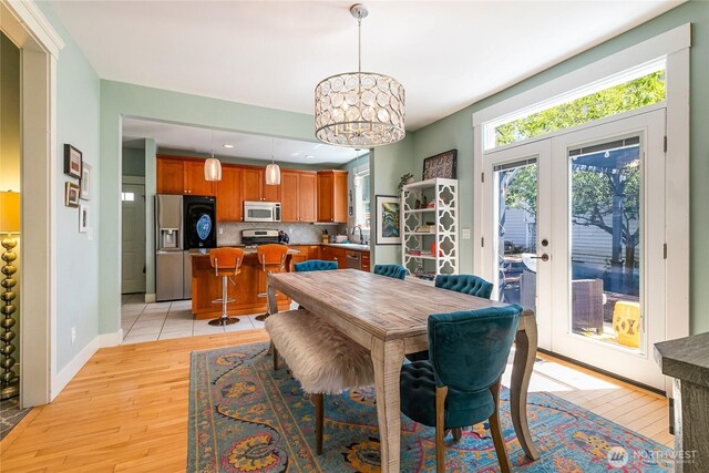 805 11th St, Bellingham, WA 98225 - dining room featuring light wood-style floors, a chandelier, baseboards, recessed lighting, and french doors
