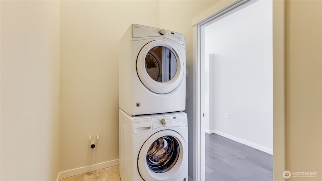 14528 35th Ave NE, Lake Forest Park, WA 98155 - laundry room with estacked washer and dryer and wood finished floors