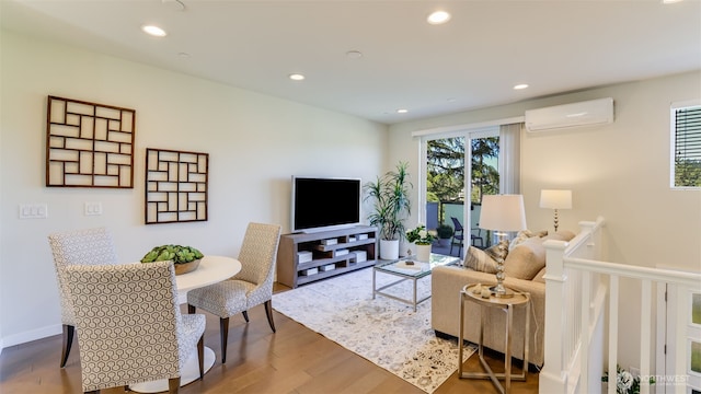 14528 35th Ave NE, Lake Forest Park, WA 98155 - living area featuring a wall unit AC, wood finished floors, and recessed lighting